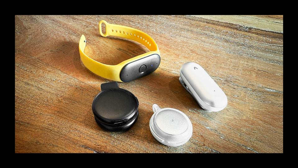 A variety of AI wearables including the Plaud NotePin and Bee wearable