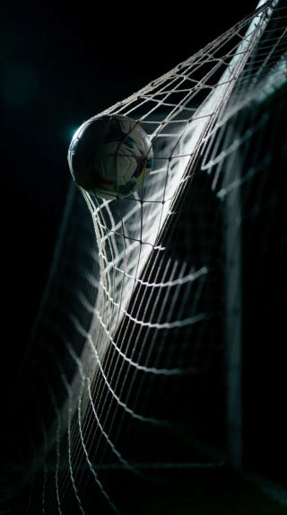 A vertical soccer wallpaper for iPhone featuring an aesthetic stadium background