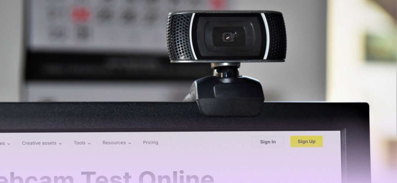 A person testing their webcam on a laptop to ensure video quality and privacy settings are correct.