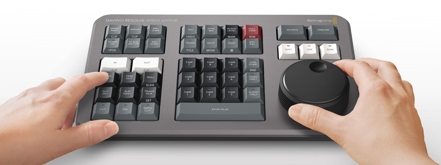 Close-up of the DaVinci Resolve Speed Editor search dial showing metal texture