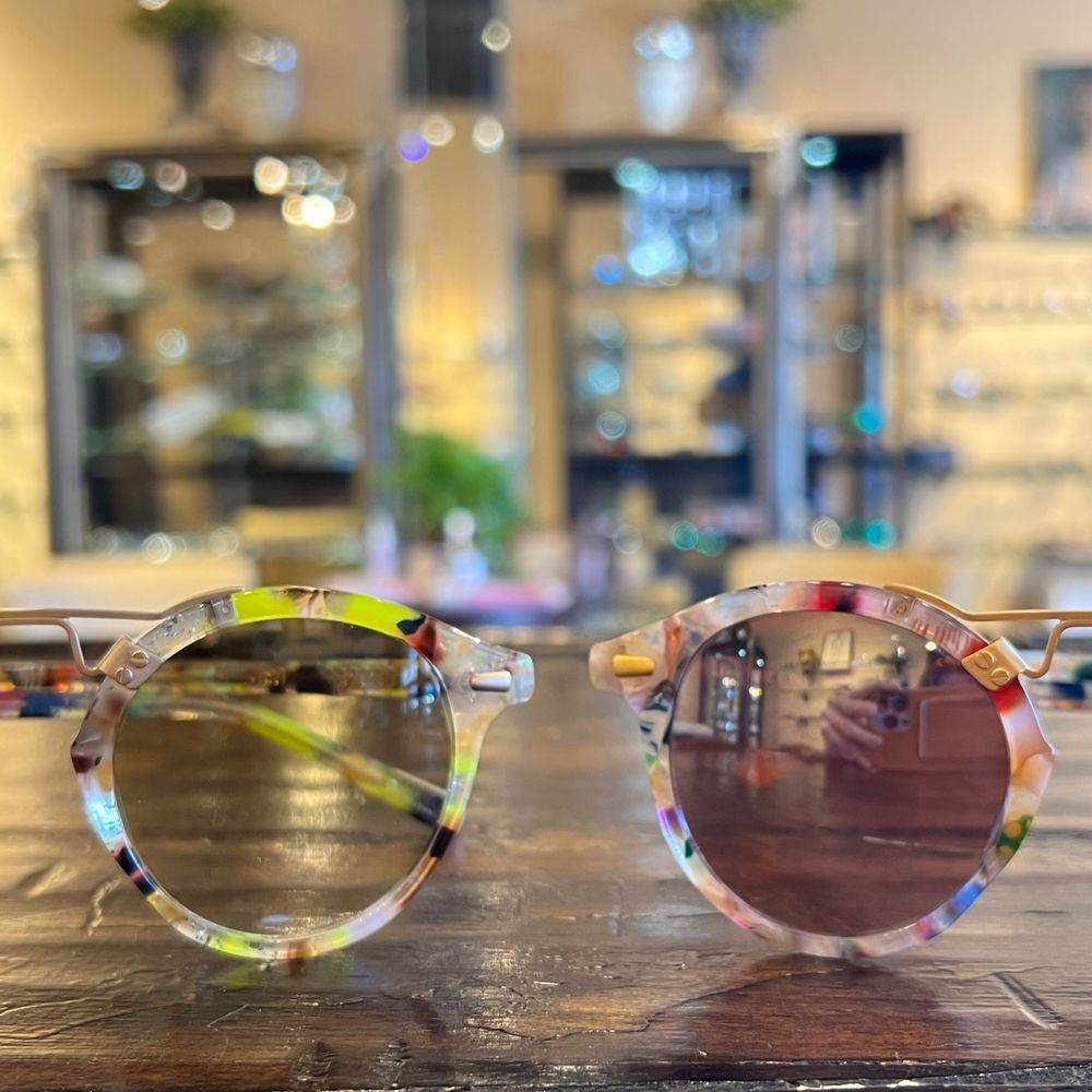 A selection of luxury designer frames in a boutique display