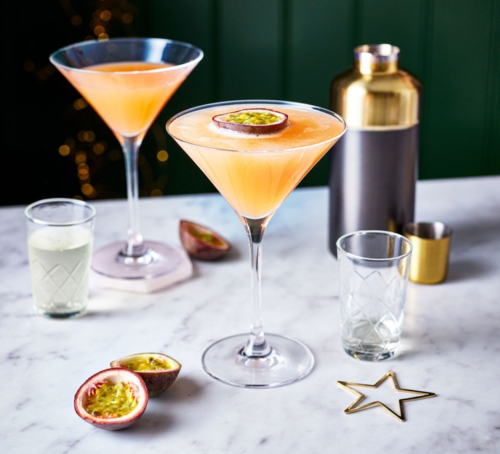 A modern passion fruit martini with a fresh garnish