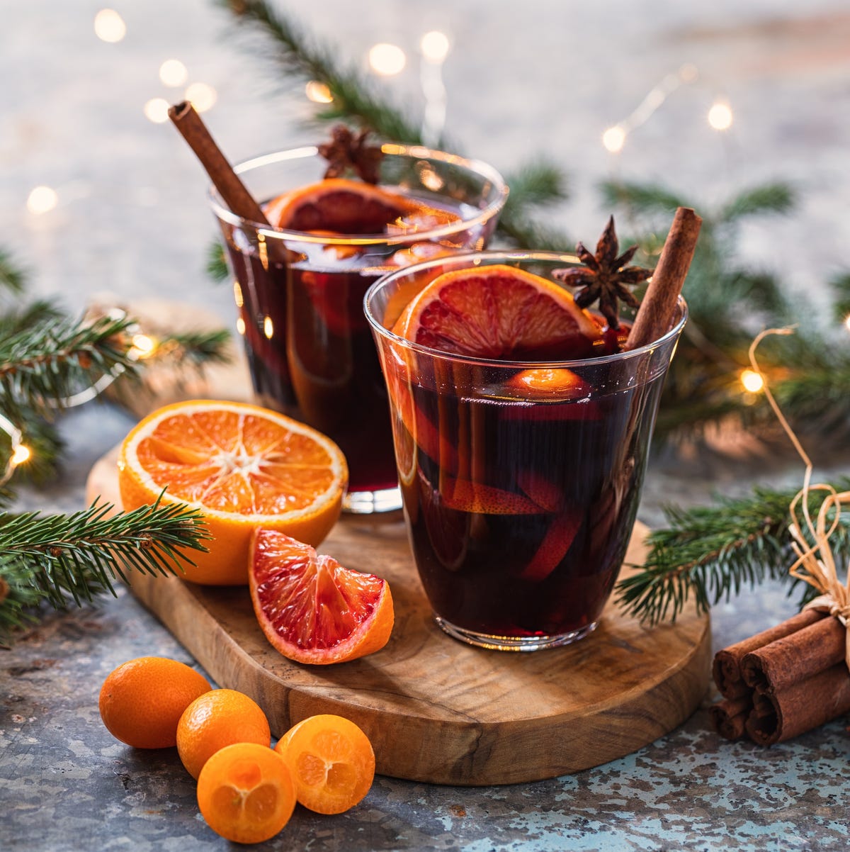 A steaming glass of mulled red wine with cinnamon and star anise