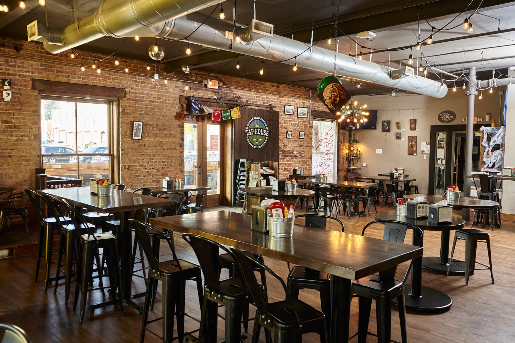 Interior of a modern craft beer tap house with industrial lighting