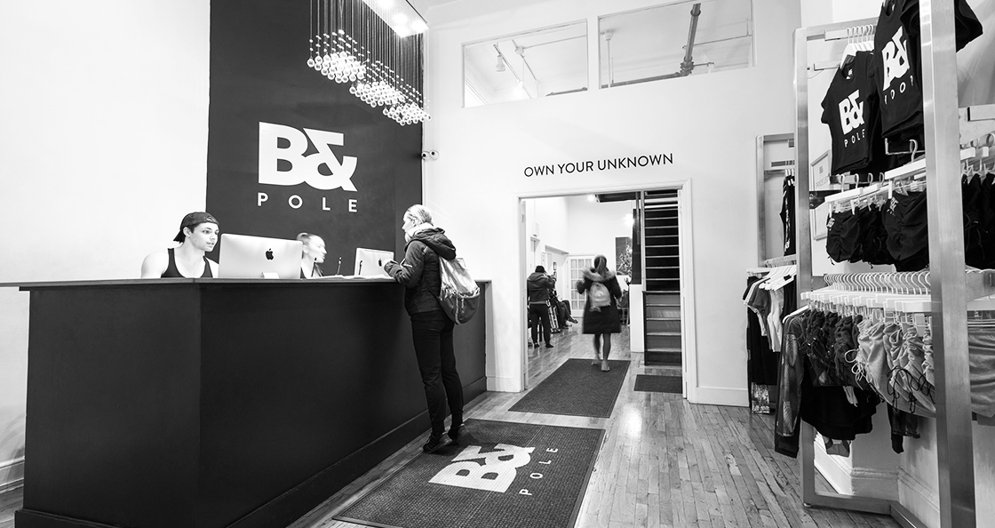 The modern reception area at Body & Pole New York studio