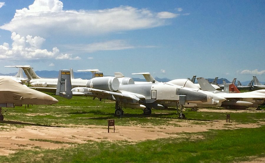 Tour bus driving through the aircraft storage area at Davis-Monthan