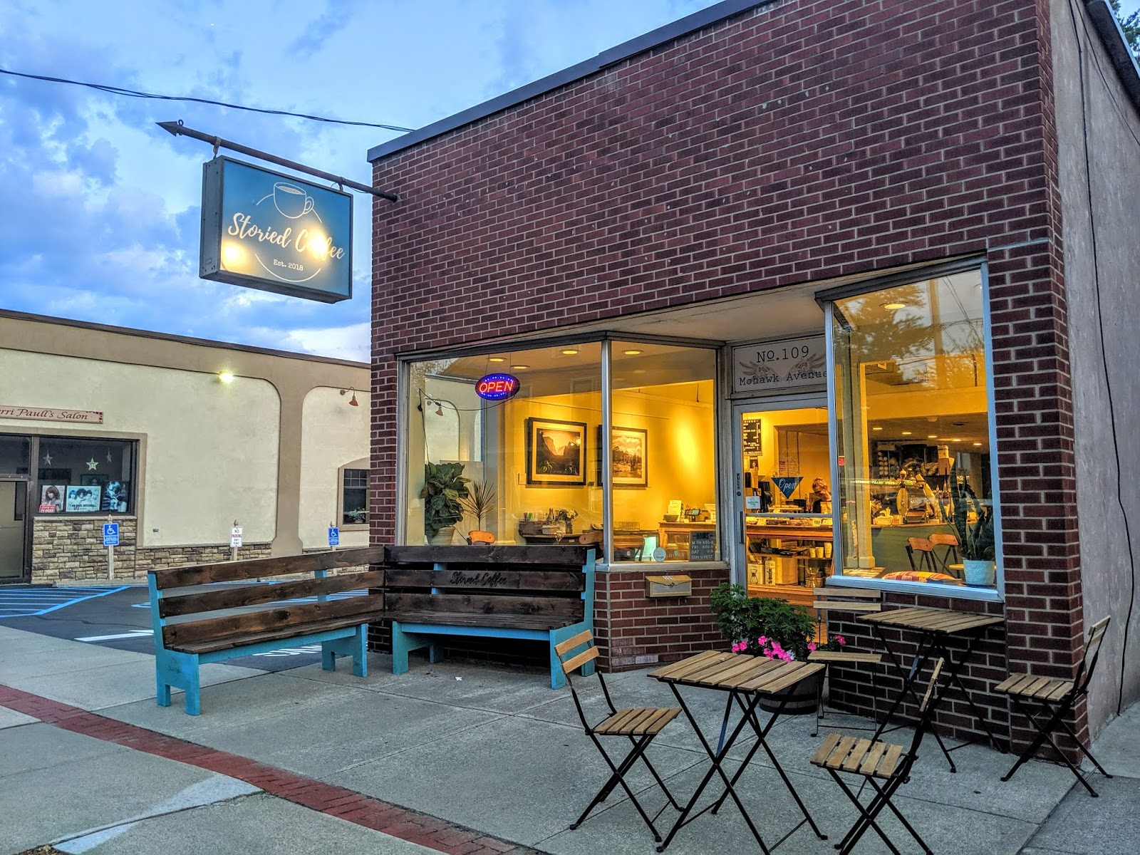 Interior of Storied Coffee showing the cozy seating and vintage decor