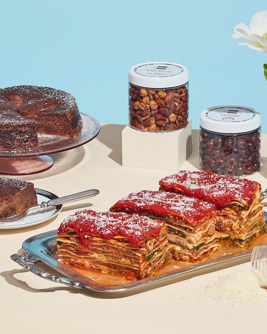 Assorted New York food gifts including deli meats and lasagna