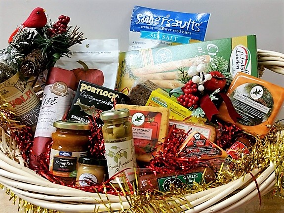 A well-balanced savoury gift basket featuring crackers, cheese, and nuts