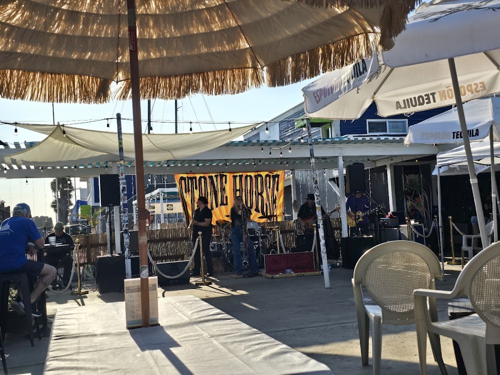 Interior of Aquarius Bar & Grille showing the stage and bar area