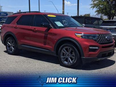 A white used Ford Explorer on a dealership lot