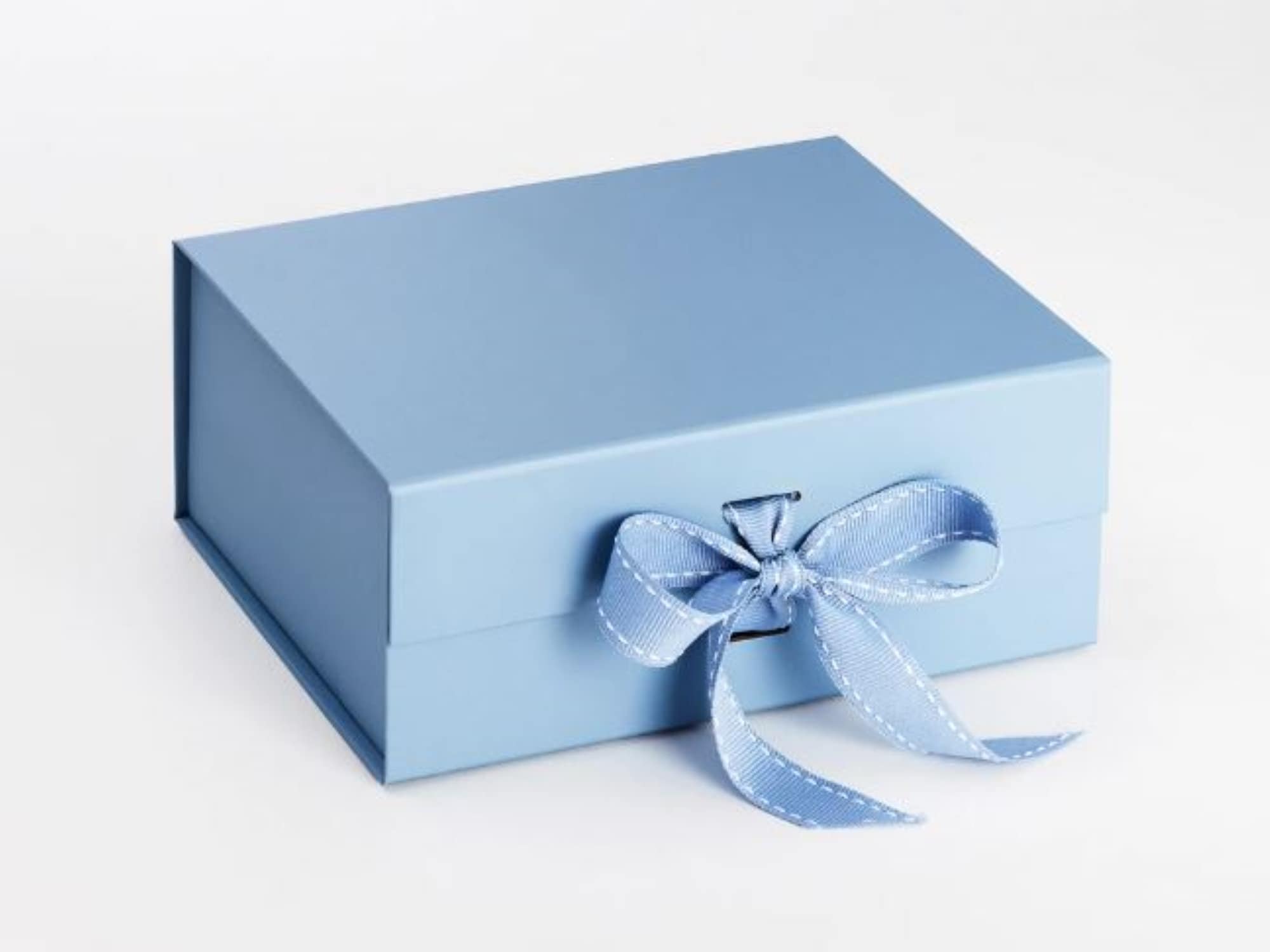 Luxury blue magnetic gift box with a premium ribbon closure