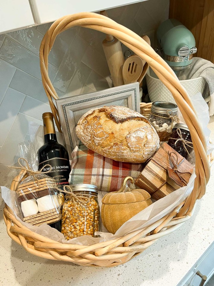 A survival gift basket with cleaning supplies and snacks