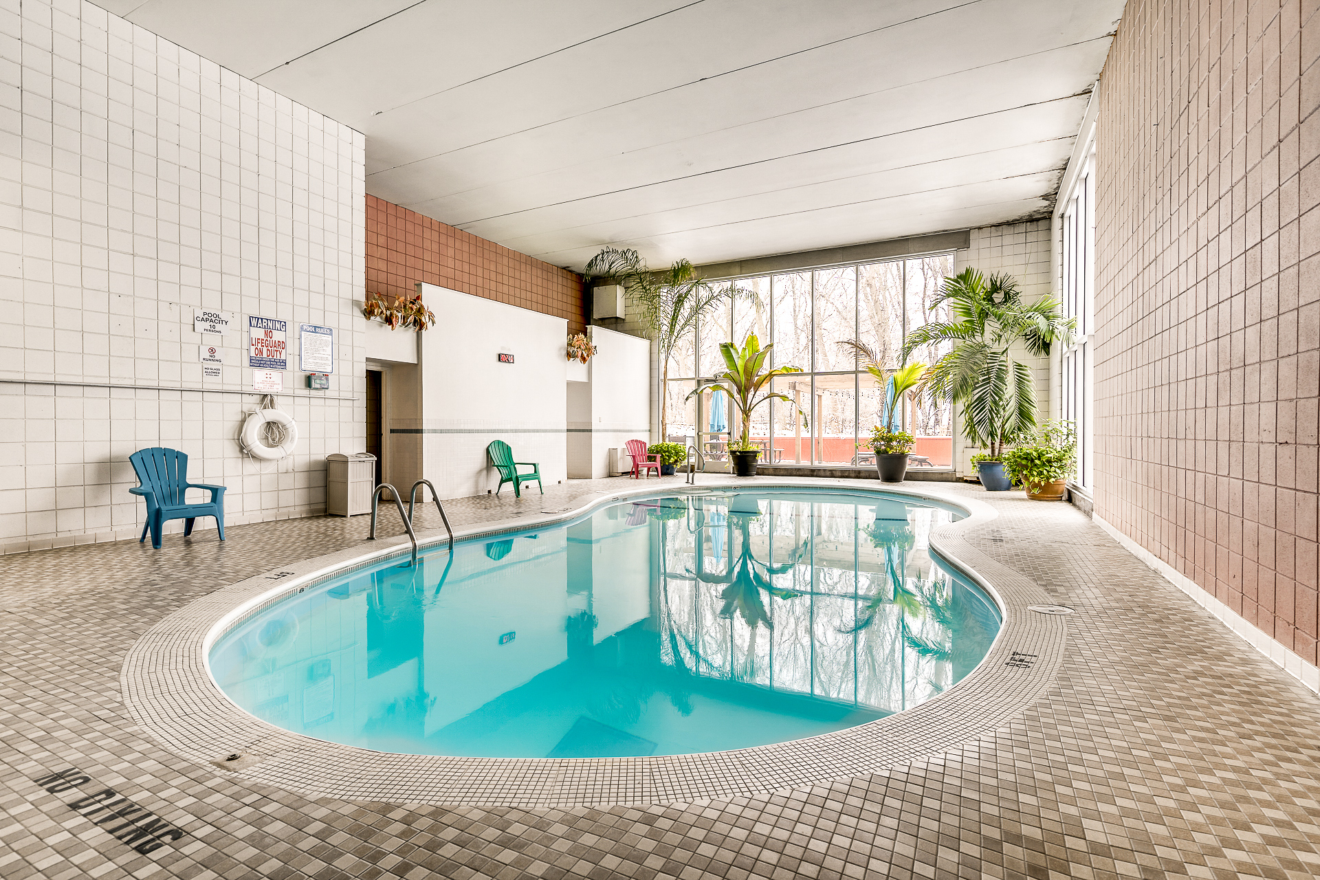 Indoor pool and lounge area at Aquarius Apartments Roseville
