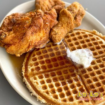 Signature Lo-Lo's Chicken and Waffles plate with syrup